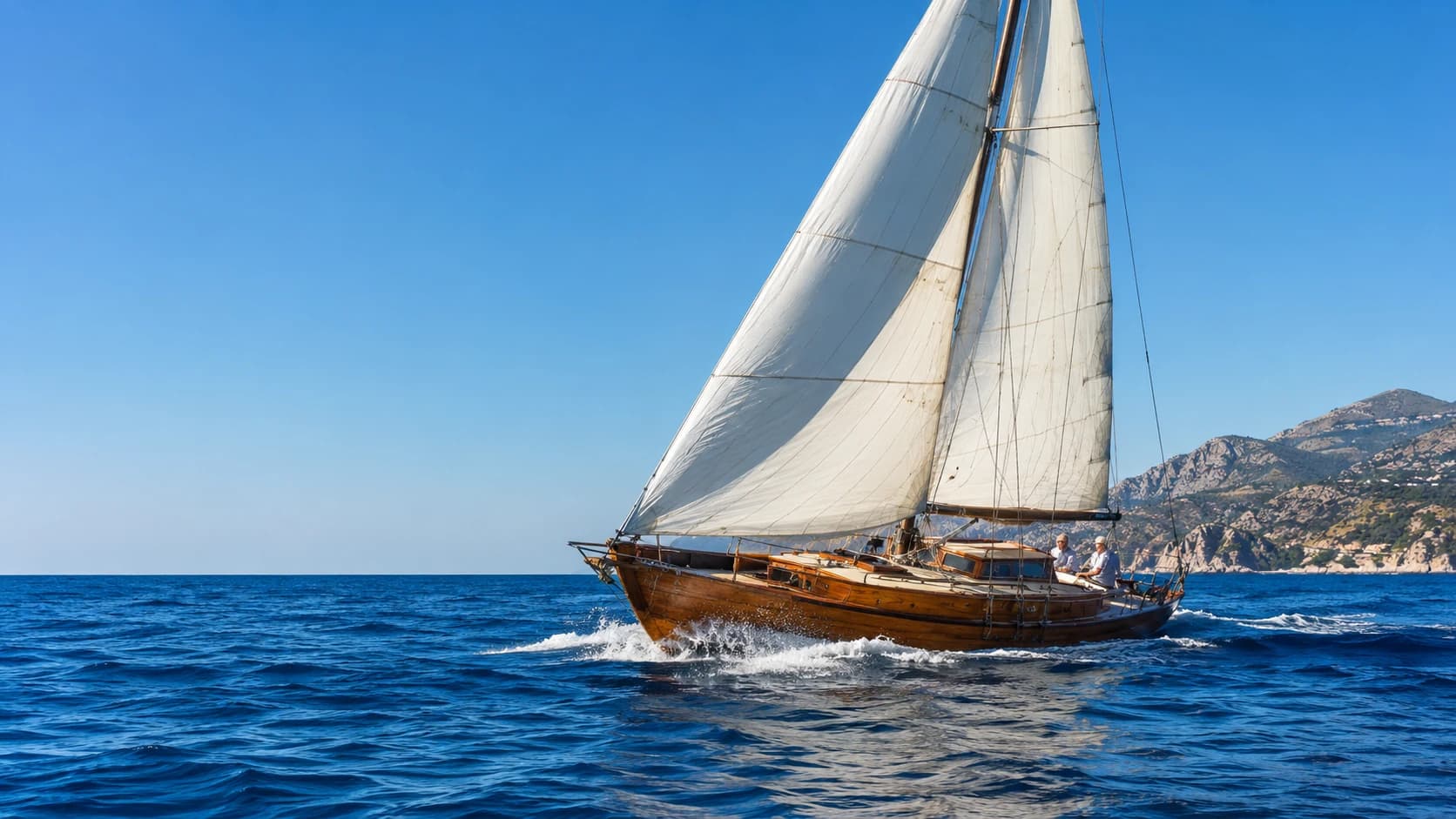 Classic wooden sailboat on the blue Sicilian sea